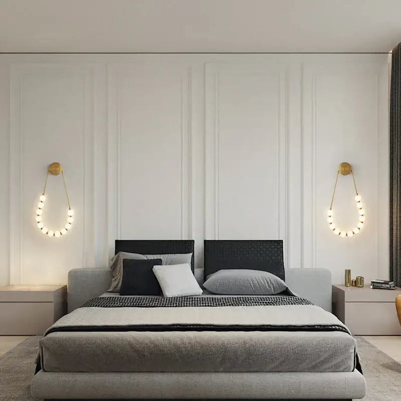 Modern gray upholstered bed with black textured headboard and decorbites led wall sconce in black gold lighting