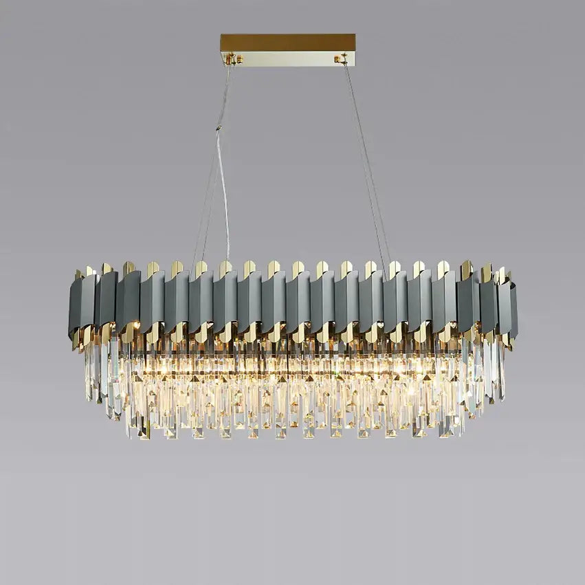Modern oval pendant lights with sleek gray and gold metallic panels and cascading crystal prisms by DecorBites Art Deco golden design