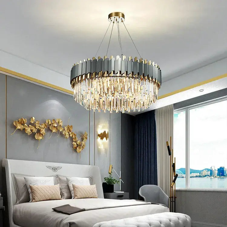 Decorbites art deco golden crystal chandelier with metallic gray and gold panels and cascading clear prisms