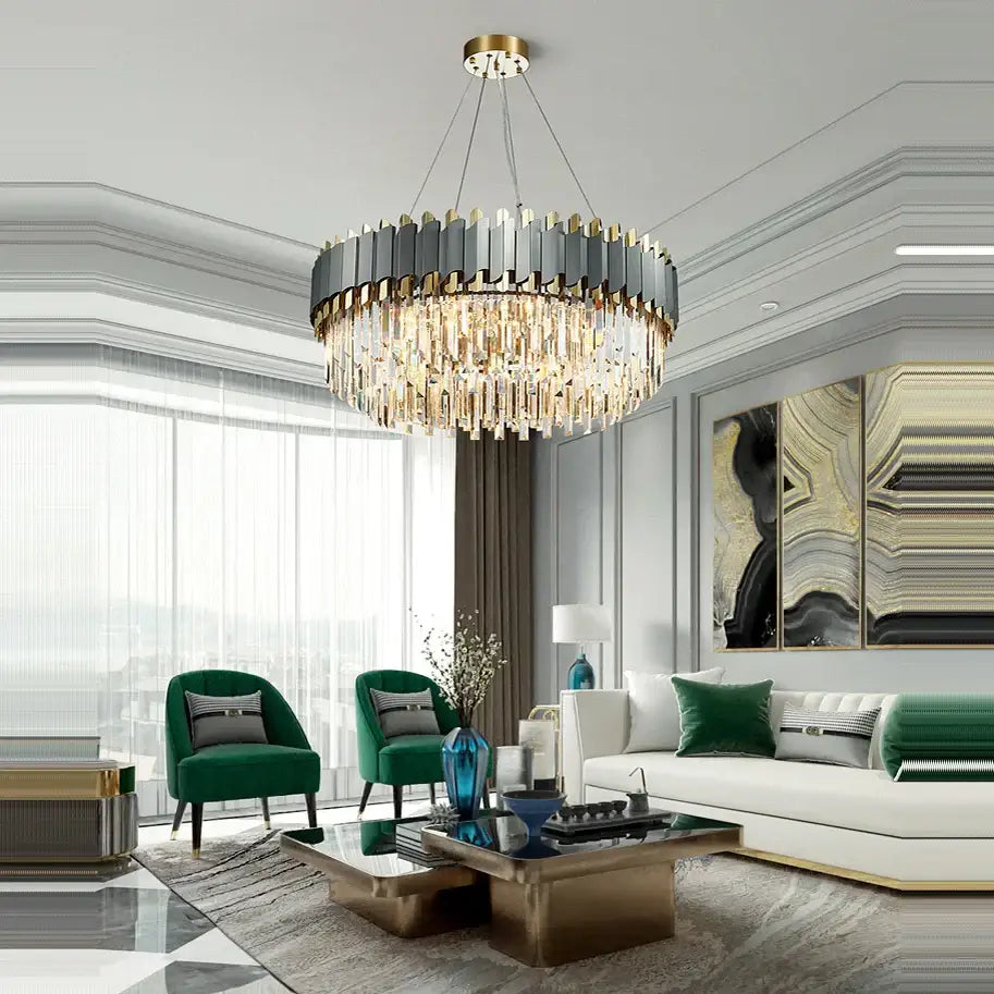 A decorbites art deco chandelier with a circular dark gray and gold frame and deco golden crystal strands