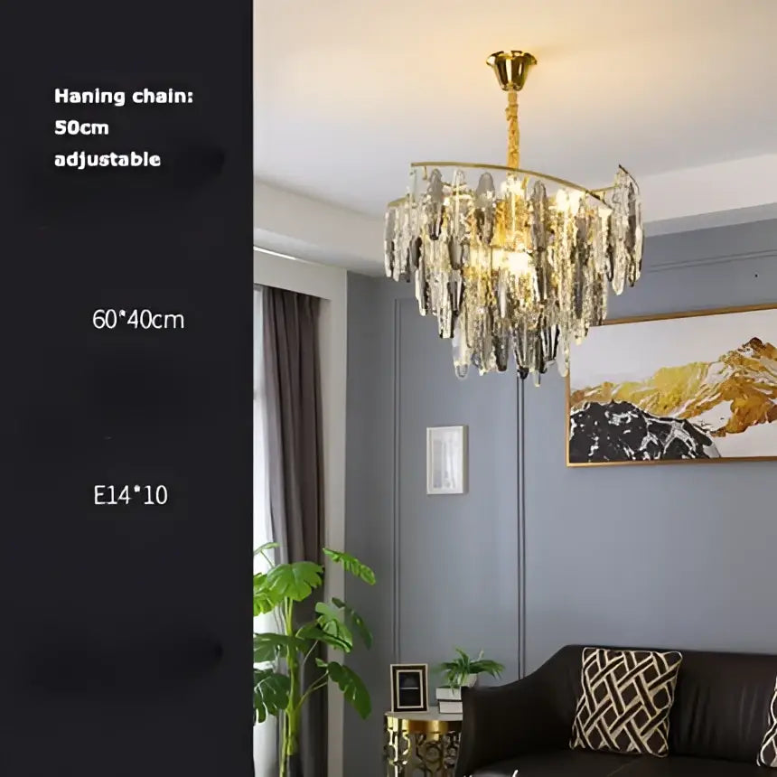 Gold-toned decorbites art deco led chandelier with dangling crystal droplets and adjustable hanging chain for foyer lighting