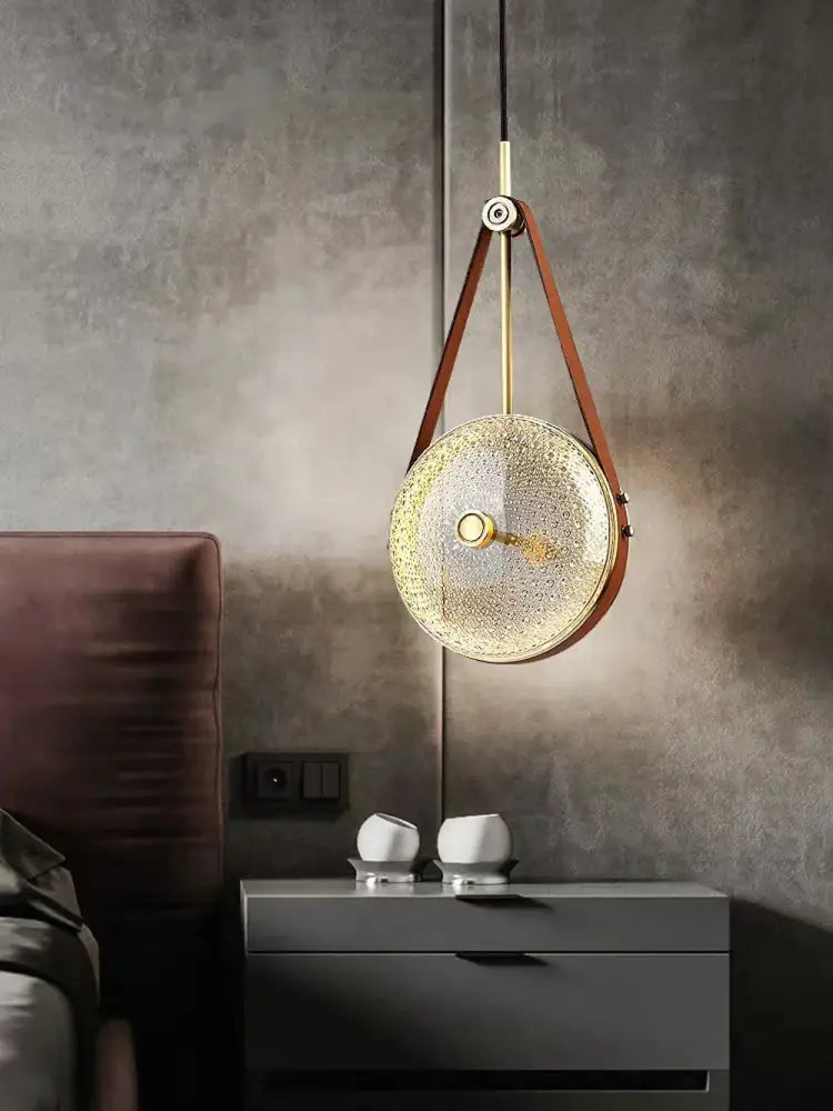 Gold-toned decorbites art deco pendant light with textured glass shade and leather straps for vintage american style lighting