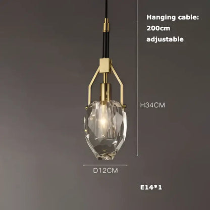 A decorbites art deco pendant light with a faceted crystal glass shade and brass-finished adjustable metal frame