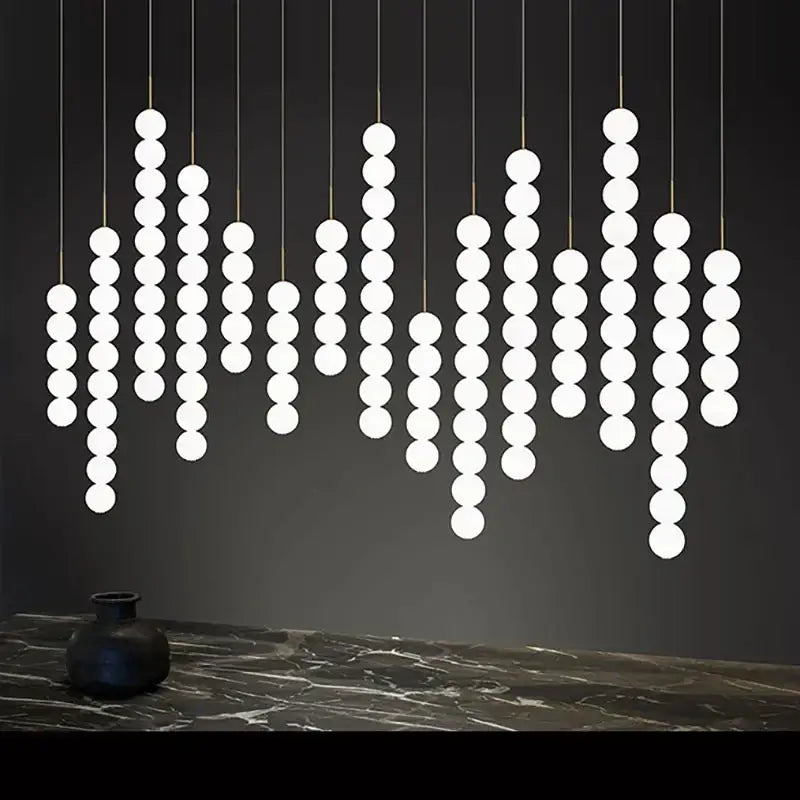 Modern white spherical pendant light in geometric pattern by DecorBites Art Deco LED glass pingpong in gold chrome black