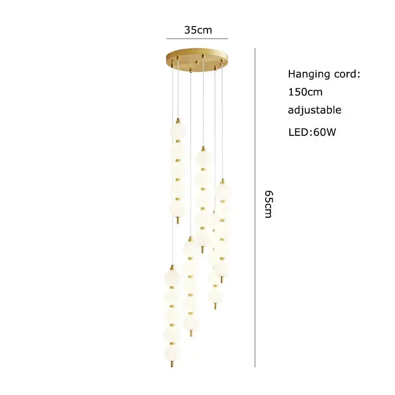 Gold-toned pendant light with frosted glass globes by DecorBites Art Deco LED glass pingpong pendant light in gold chrome black