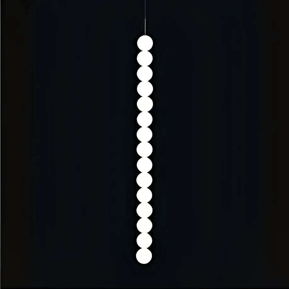 A sleek DecorBites Art Deco pendant light with vertical white spherical LED bulbs in gold chrome and black finish