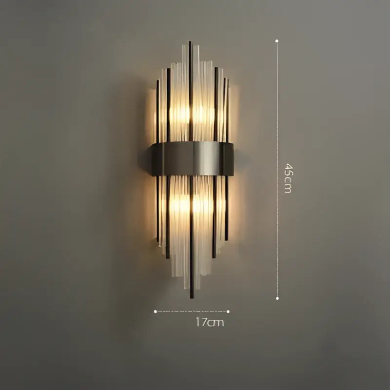 Modern decorbites art deco led wall sconce with stainless steel frame and vertical glass rods emitting warm light