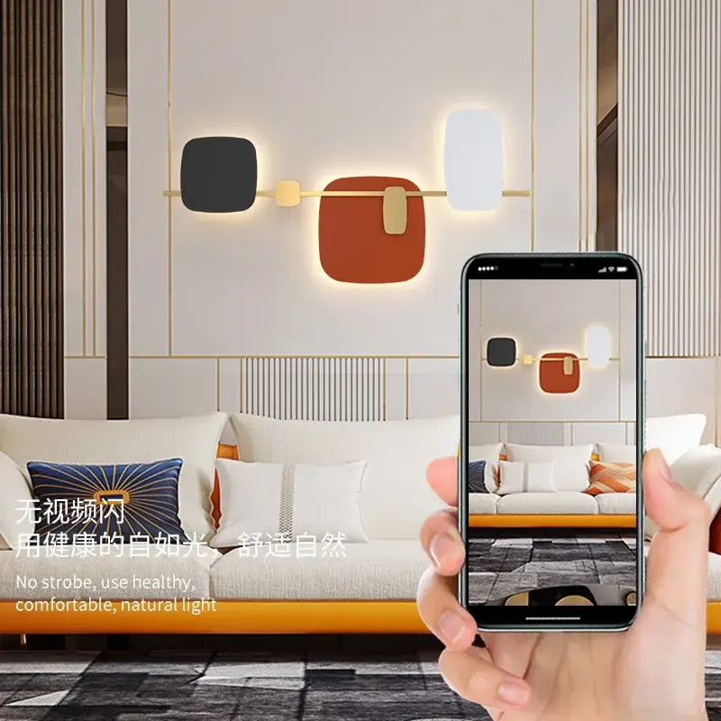 Decorbites art deco metal wall sconce with black terracotta and white geometric panels on gold bar for bedroom and hotel