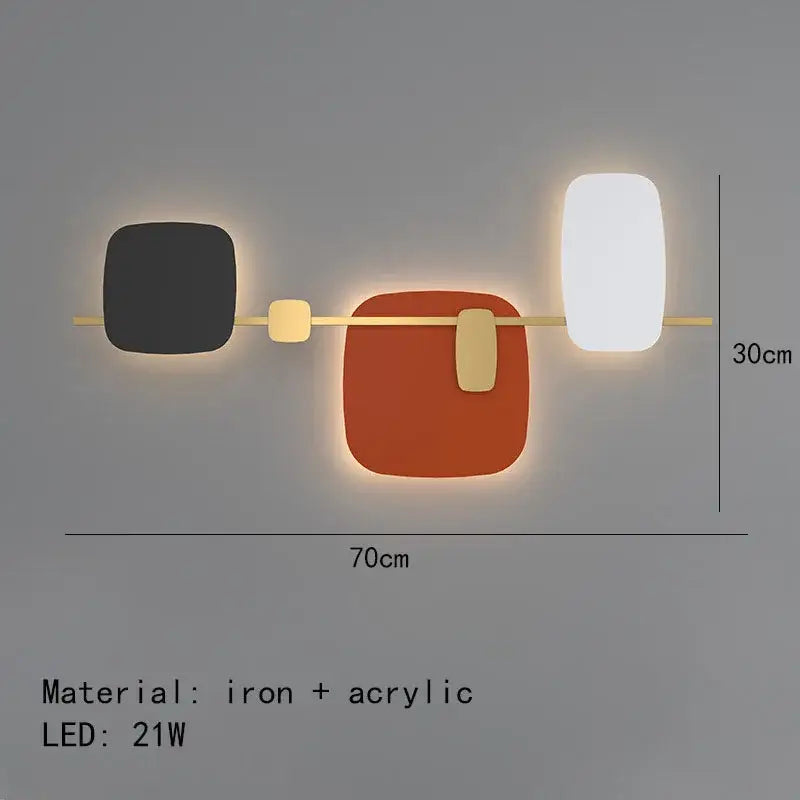 Modern geometric decorbites art deco wall sconce with black orange and white acrylic panels on brass iron frame