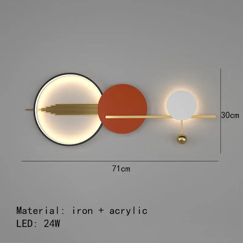 Modern minimalist DecorBites Art Deco wall sconce with black LED light, orange acrylic disc, and gold metal accents