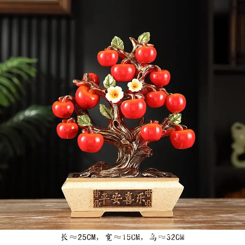 DecorBites™ artificial fruit tree apple basket figurine with a glossy red apple, carved brown trunk, green leaves, and white flowers