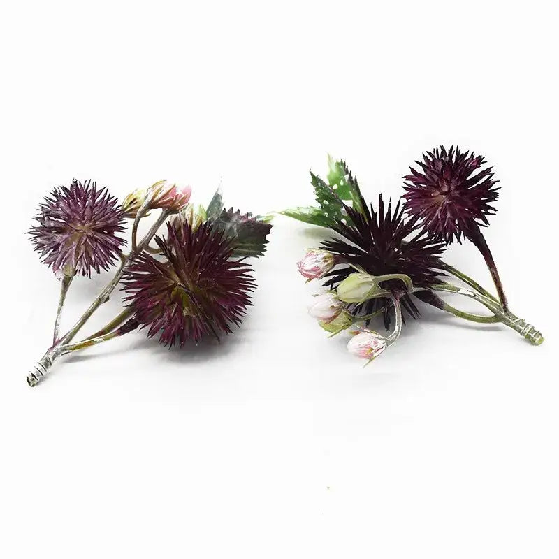 DecorBites artificial grass plants featuring dark purple spiky flowers with green stems and pink buds for home decor