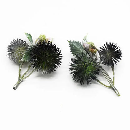 Decorbites™ artificial grass plants featuring black and green thistle flower arrangements with spiky spherical heads
