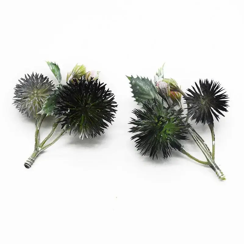 Decorbites™ artificial grass plants featuring black and green thistle flower arrangements with spiky spherical heads