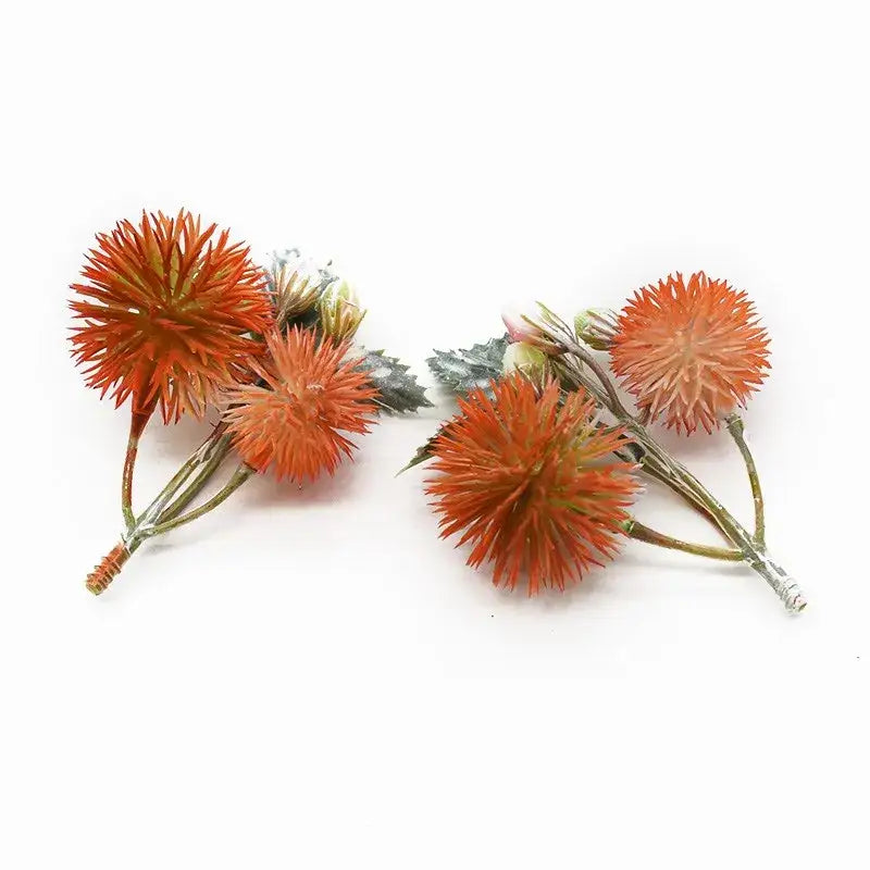 Decorbites™ artificial grass plants featuring orange spiky flower clusters with green stems and leaves for home decor