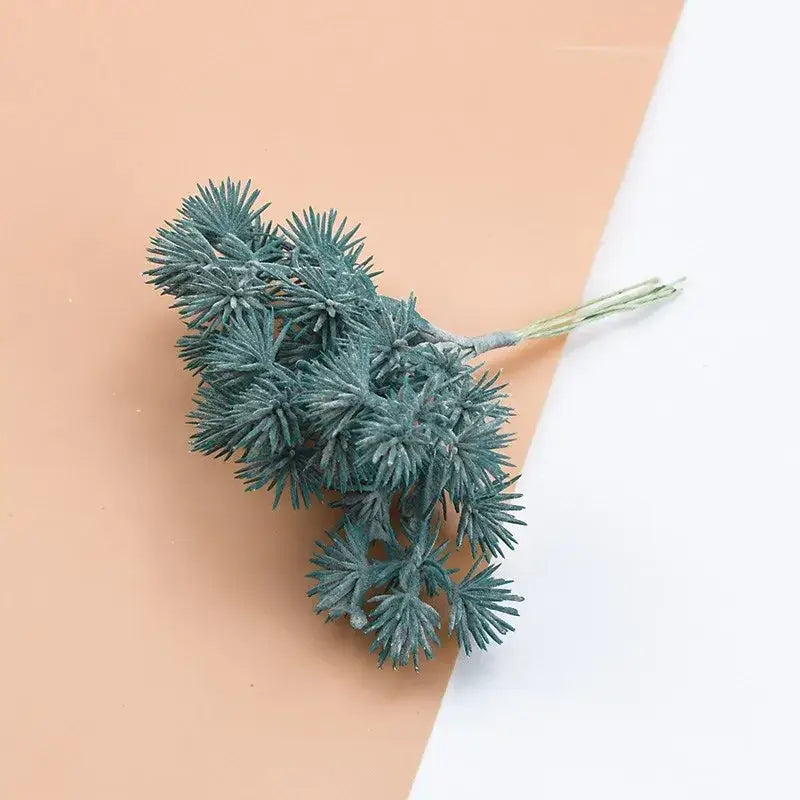 A cluster of green artificial gypsophila plants with textured spiky pine needles for home decor and diy gifts