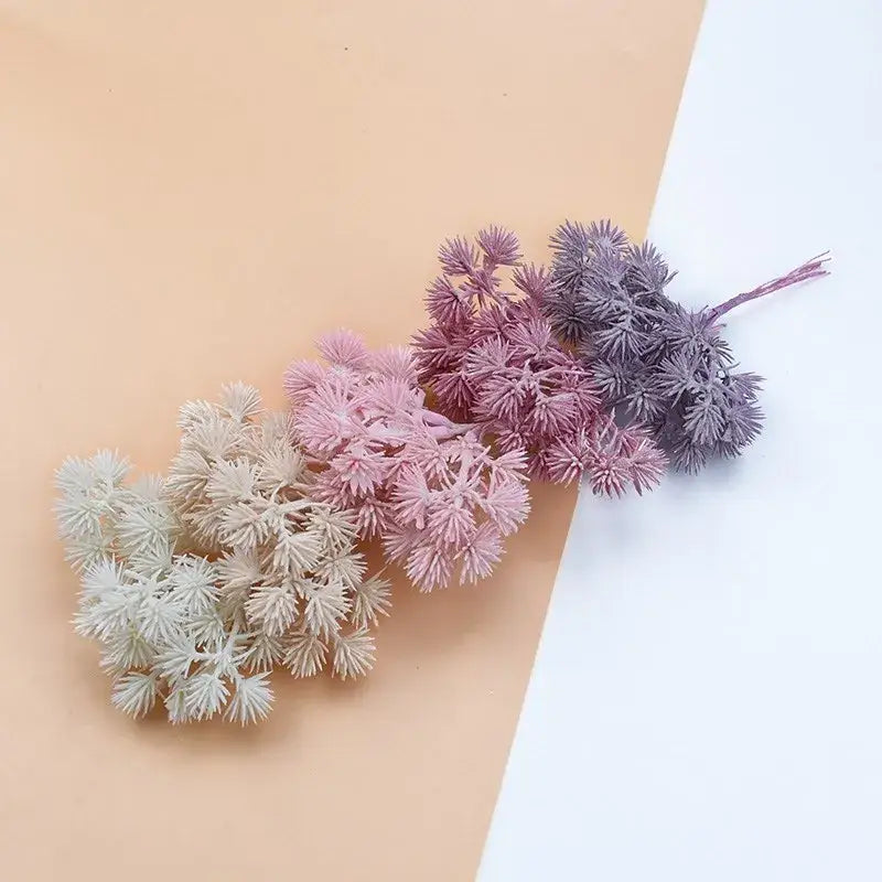 A set of artificial gypsophila plants in cream pink and purple pastel shades ideal for home decor and diy gifts