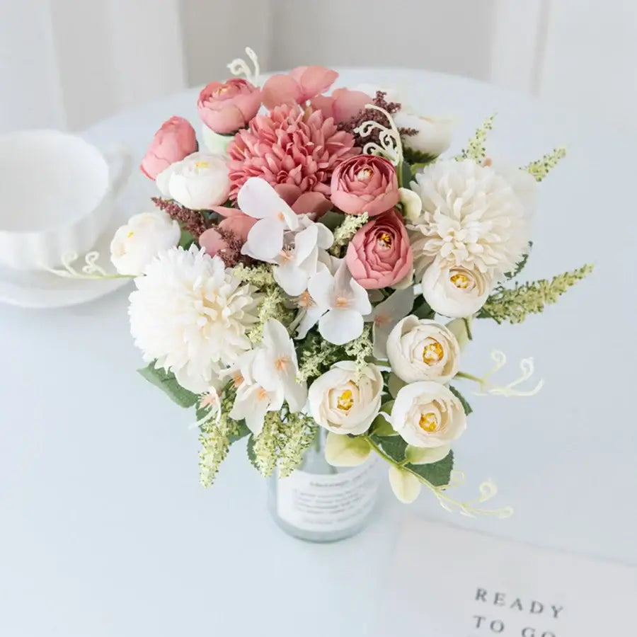 A decorbites artificial hydrangea tea rose bouquet with soft pink and white petals in a clear glass vase for home decor
