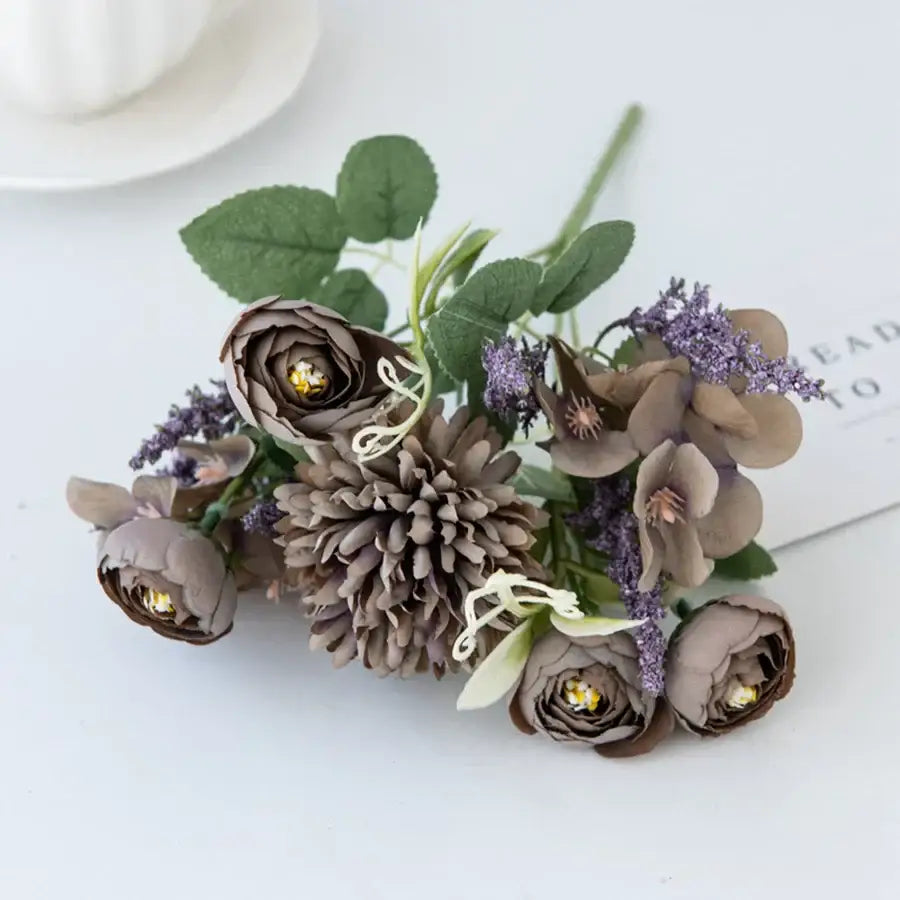 A decorbites artificial hydrangea tea rose bouquet featuring delicate taupe and lavender petals with green leaves for decor