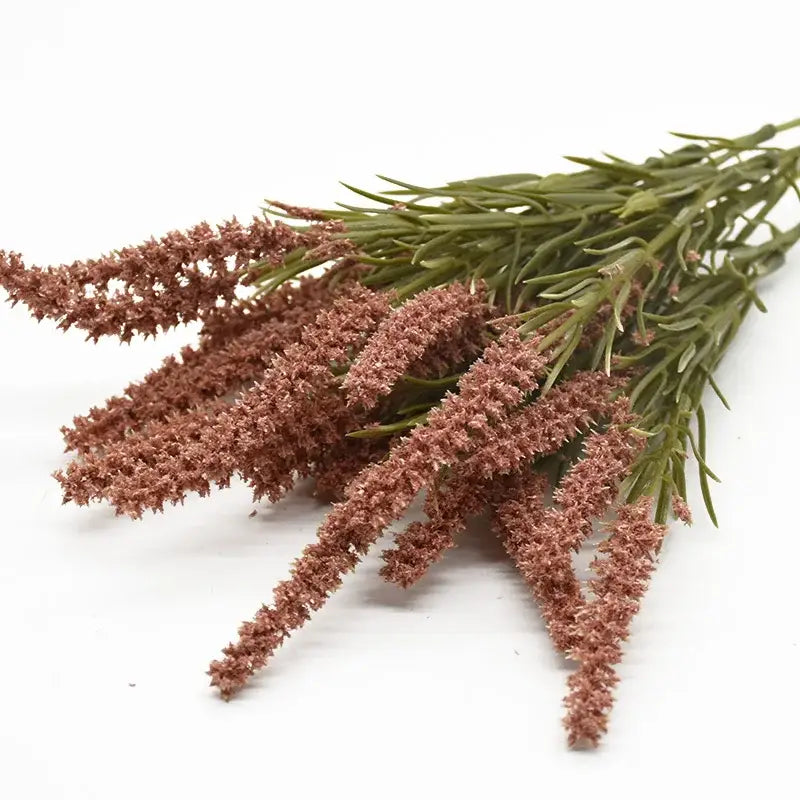 A bundle of dusty rose artificial lavender plants with slender green stems for home decor and wedding diy use