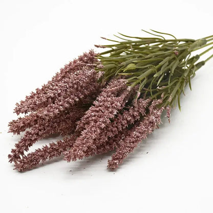 A bundle of decorbites artificial lavender plants with green stems and feathery lavender-colored grass for home decor