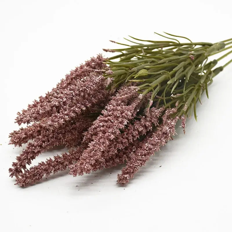 A bundle of decorbites artificial lavender plants with green stems and feathery lavender-colored grass for home decor