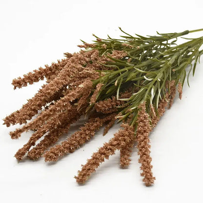 A bundle of artificial lavender plants with brown and green grass-like stems and textured feathery tips for home decor