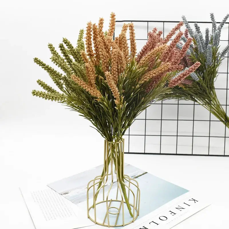 A golden wireframe vase holding multicolored artificial lavender plants for home decor and wedding diy by decorbites