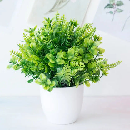 Decorbites artificial mini plant featuring a lush green fern bush in a white ceramic pot for desktop bonsai decor