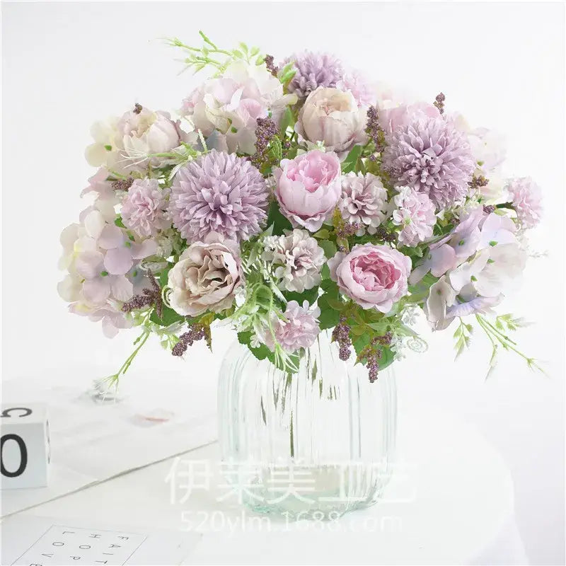 Decorbites artificial peony flower bouquet in lavender blush pink and cream hues in a clear glass vase for decoration