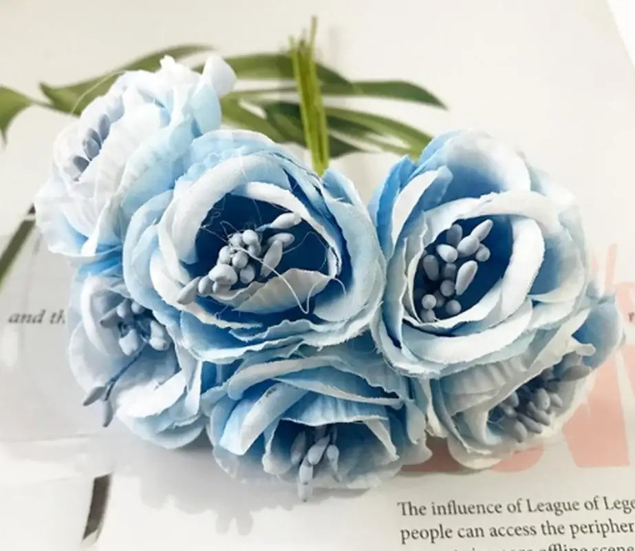 A delicate bouquet of light blue and white decorbites artificial peony tea silk flowers with layered petals and detailed centers