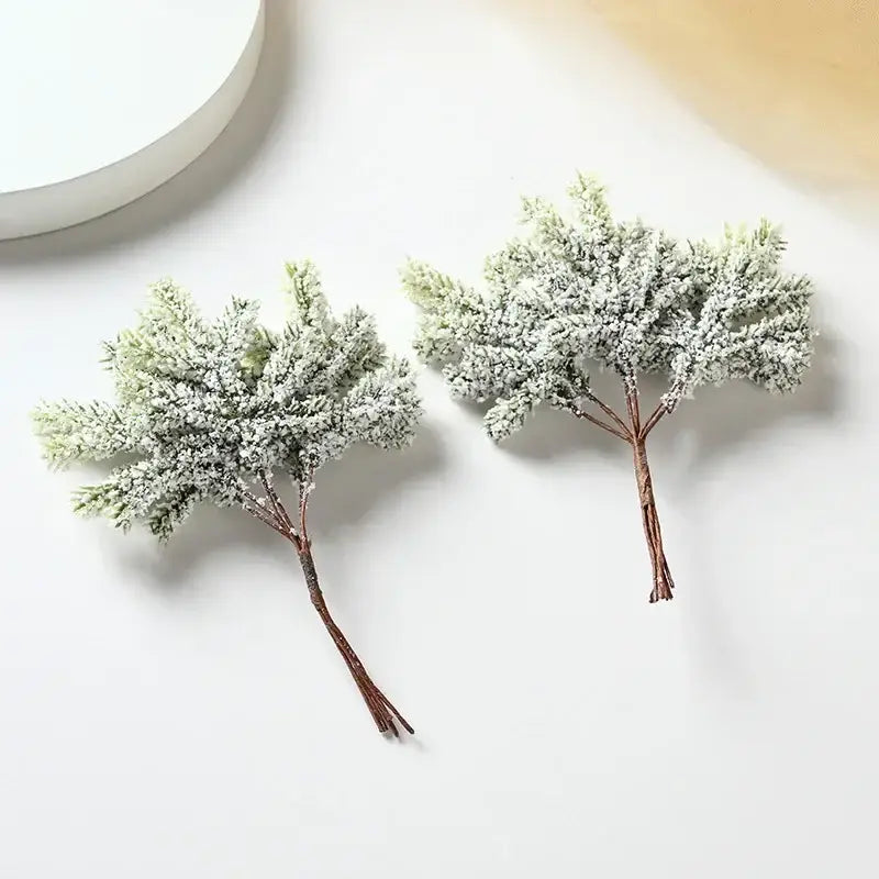 DecorBites™ artificial pine needles with frosty white coating and brown stems for home decor and Christmas garlands