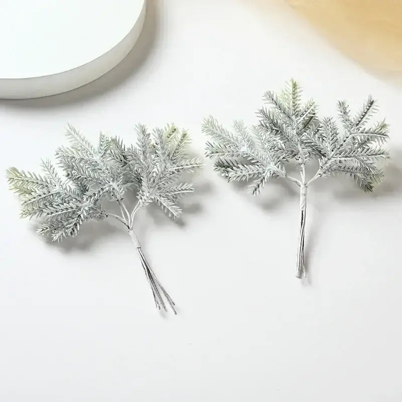 Two frosted silver artificial pine sprigs with detailed needle leaves for decor and christmas garlands by decorbites