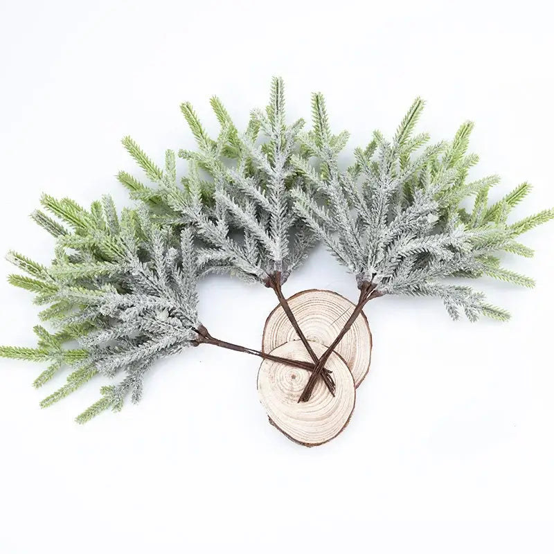 Frosted green DecorBites artificial pine plants with textured needle-like foliage and dark brown stems for wreath decoration