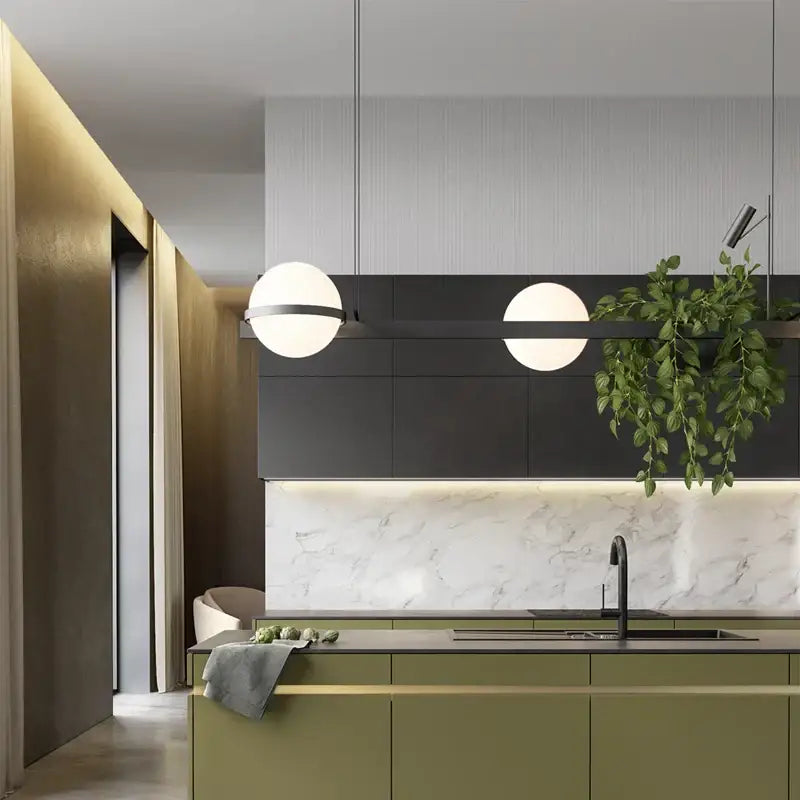 Modern spherical pendant light with matte black frame hangs above kitchen island decorbites artificial plant pendant