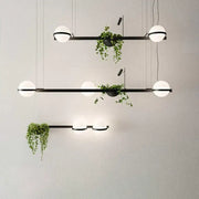 Modern black metal pendant light with frosted white bulbs and decorbites artificial plant pendant for nordic diy sky garden