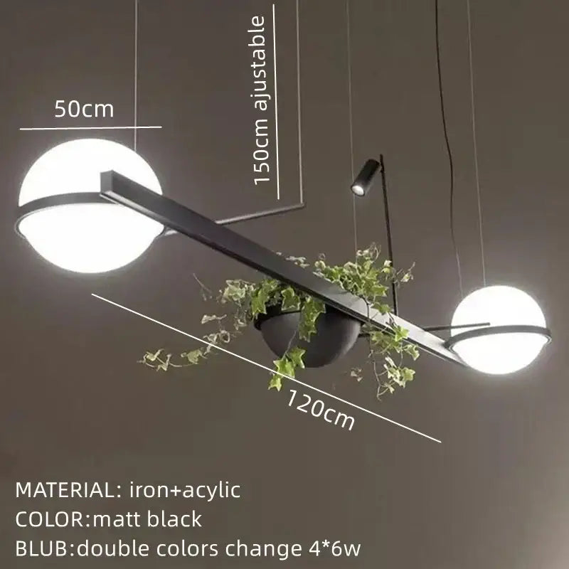 Modern matte black iron and acrylic pendant light with spherical white glass shades and decorbites artificial plant pendant