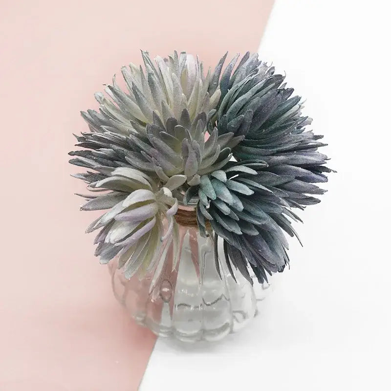 A cluster of green fake flowers in a clear textured glass vase decorbites artificial plant christmas decor