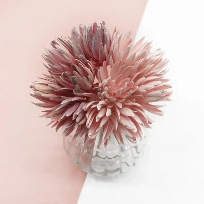 A decorbites artificial plant featuring delicate pink and white fake flowers in a clear textured glass vase for christmas decor