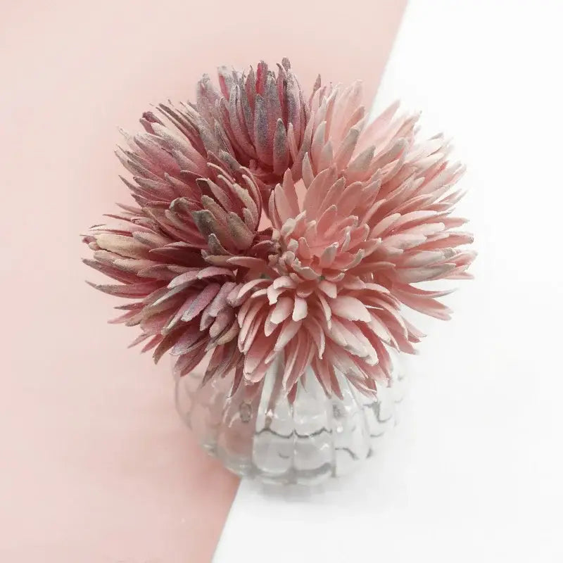 A decorbites artificial plant featuring delicate pink and white fake flowers in a clear textured glass vase for christmas decor