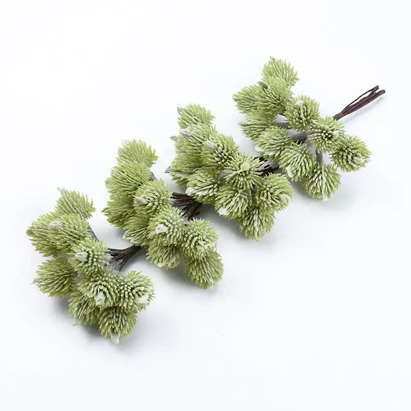 Light green artificial pine branch clusters with frosted tips made of synthetic fibers for decorbites artificial plants christmas decor