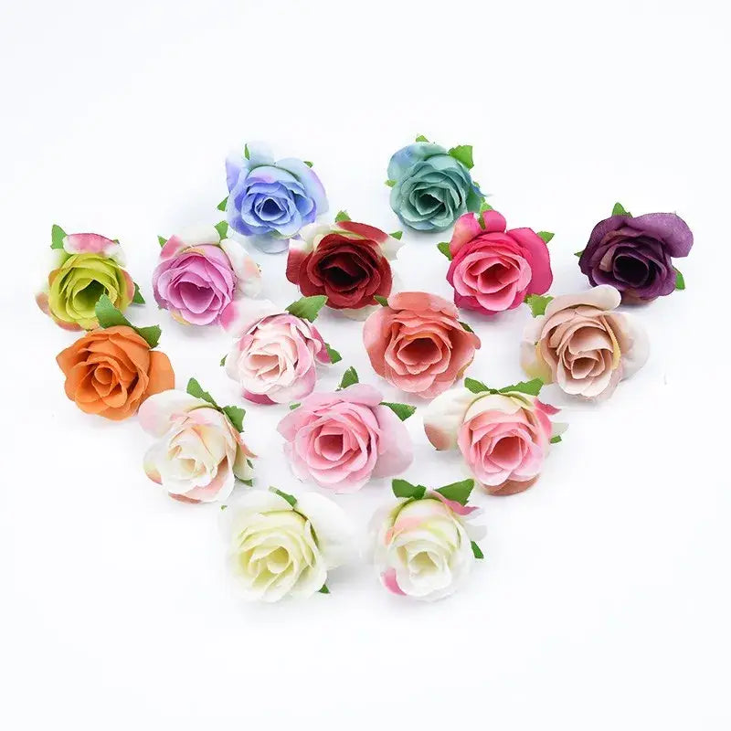 A collection of pastel and vibrant fabric artificial plants decorative flowers brooches with delicate green stems for decor