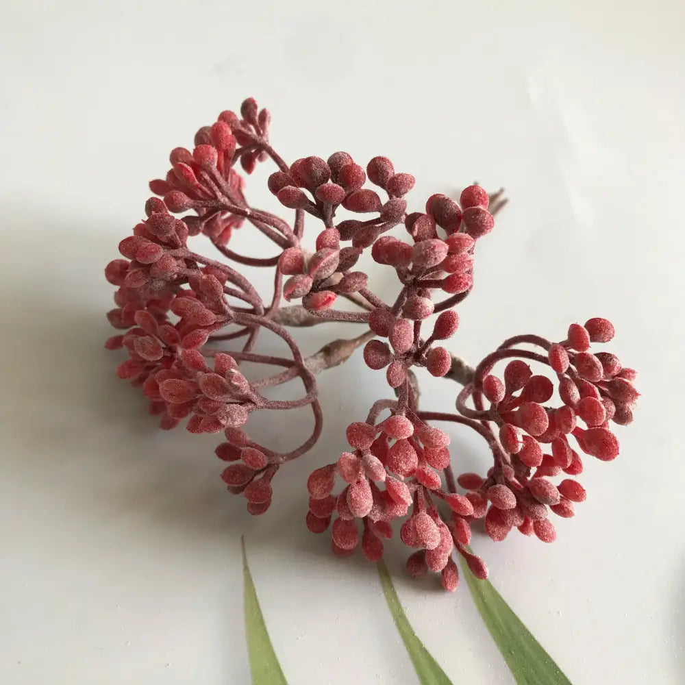 A cluster of red frosted artificial berries on brown stems from decorbites artificial plants diy dried plants garland decoration