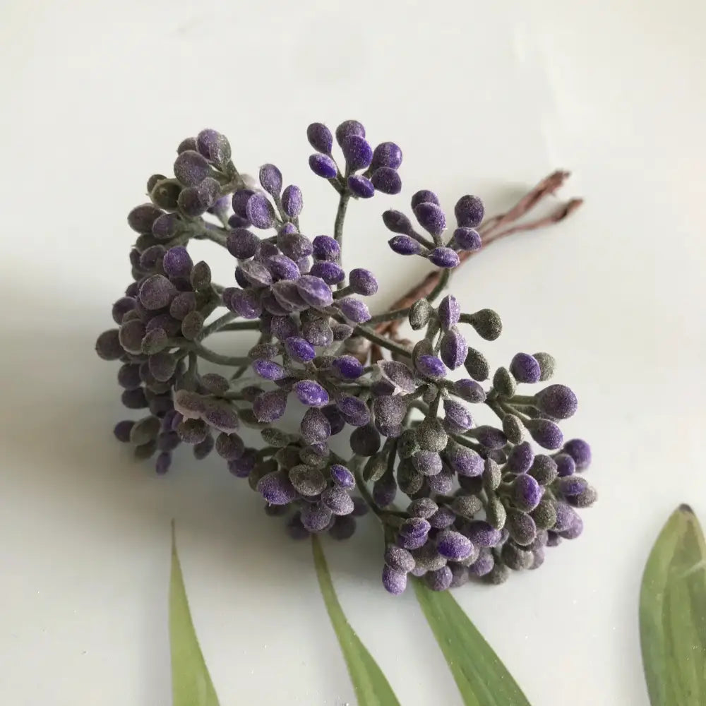 A cluster of purple frosted artificial lavender buds with dark green stems from DecorBites artificial plants diy dried plants