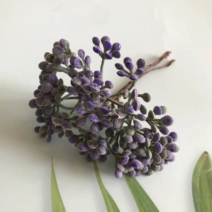 A cluster of purple frosted artificial lavender buds with dark green stems from DecorBites artificial plants diy dried plants