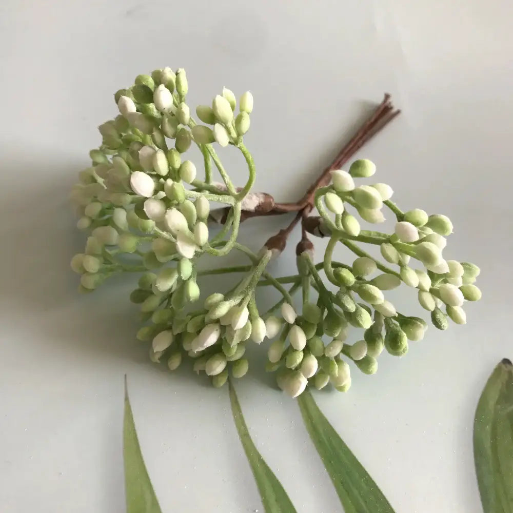 A delicate cluster of white and light green dried plants from decorbites artificial plants diy garland craft decoration adornment