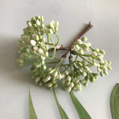 A delicate cluster of white and light green dried plants from decorbites artificial plants diy garland craft decoration adornment