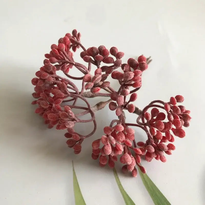 A cluster of red frosty artificial berries with dark brown stems from decorbites artificial plants diy dried plants garland