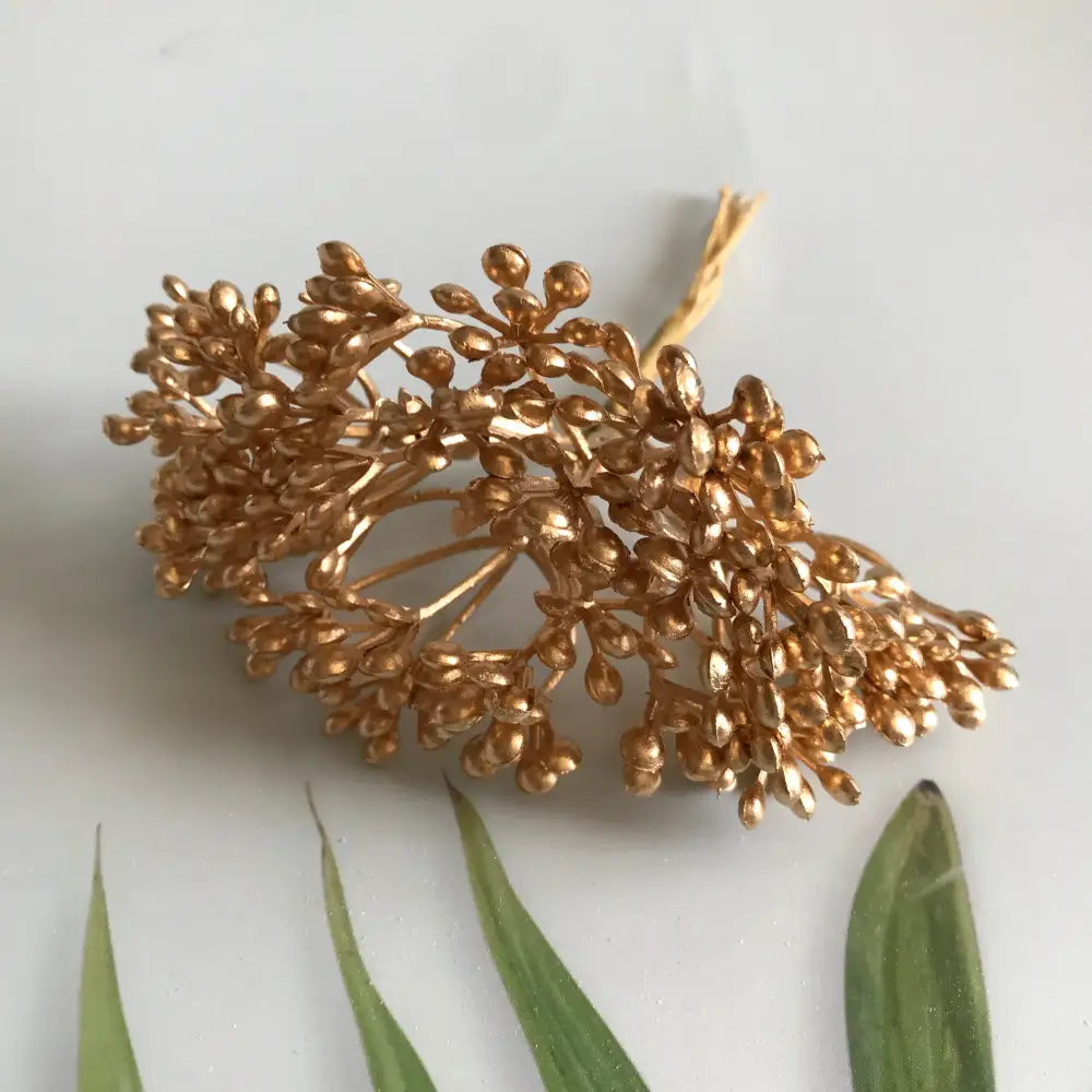 Golden metallic floral hair accessory with intricate clustered leaf and bud design by decorbites artificial plants diy dried plants