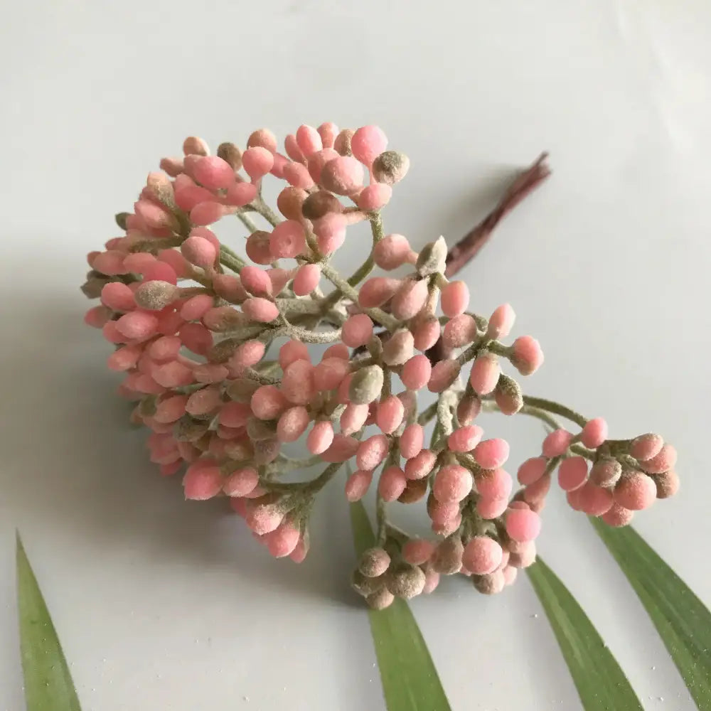 A cluster of pink frosted artificial berries on green stems from decorbites artificial plants diy dried plants garland